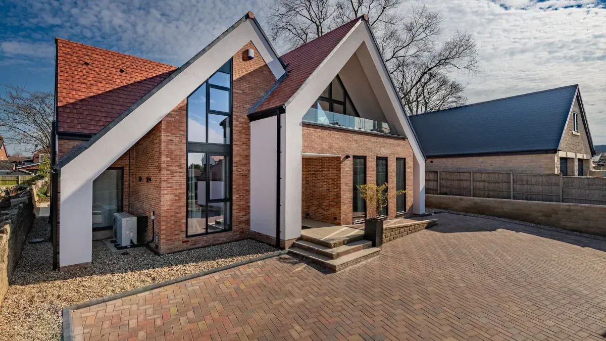 Contemporary bespoke new build home at Crowgate, South Anston, with a brick gable and full-height glazing